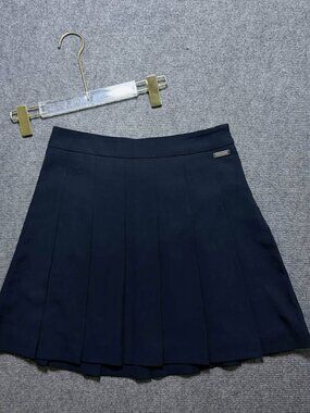Classic Navy Blue Pleated Mini Skirt with High Waist and Decorative Metal Logo